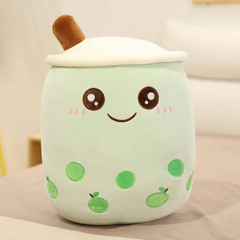 Plush green fruit boba stuffed toy with embroidered eyes and smiling face