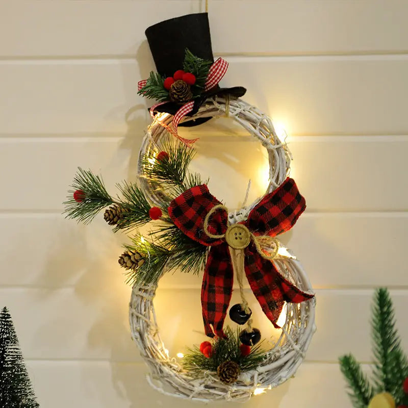 40cm Christmas wreath snowman decoration with LED lights, pine cones, red plaid bow, and black top hat for holiday door or wall display