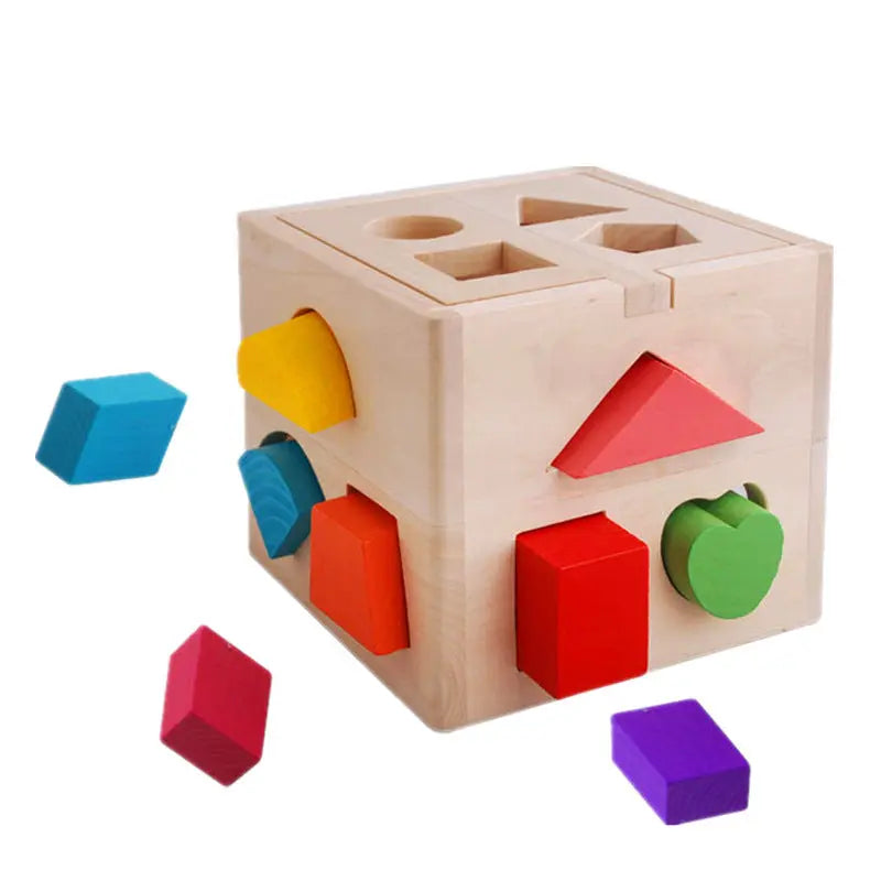 Wooden shape sorting cube with colorful blocks on a white background
