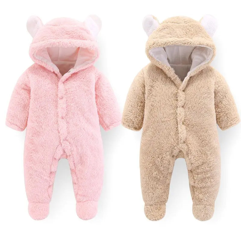 Fluffy baby winter jumpsuit in pink and beige with hood and bear ears, soft and cozy for infants.