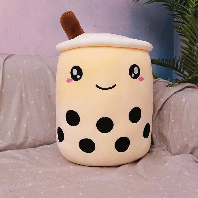Plush boba stuffed toy pillow with cute embroidered face and soft fabric in milk tea design