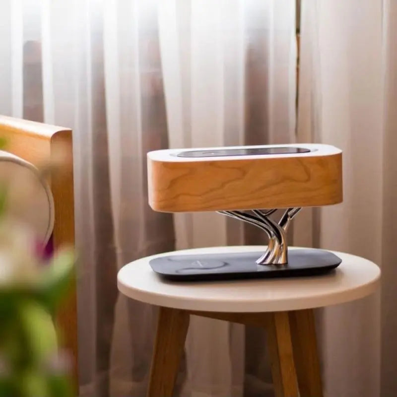 Tree of Life Table Lamp with Bluetooth speaker and wireless charging on bedside table