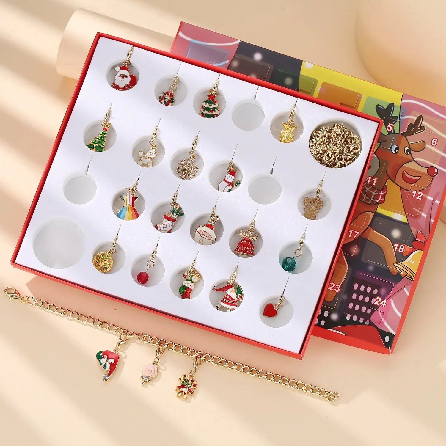 Children’s charm bracelet and necklace advent calendar with 22 festive Christmas-themed charms in a holiday gift set