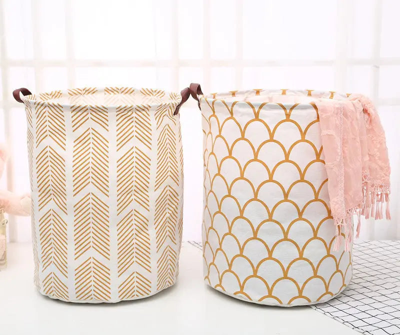 Two patterned laundry baskets on a light background