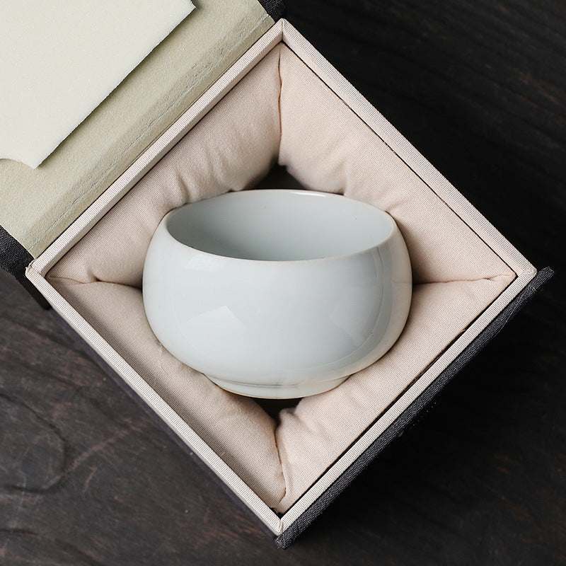 Traditional Chinese ceramic teacup in a cushioned gift box, inspired by famous kiln styles, perfect for tea lovers and collectors.