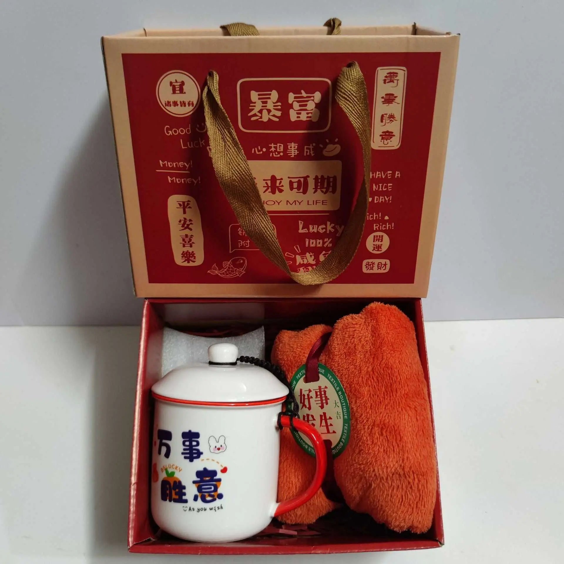 Ceramic cup gift box set with letter print mug, spoon, towel, and gift packaging in a red and beige box.