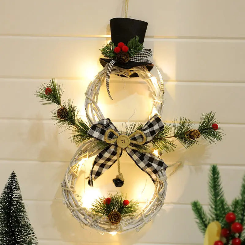 40cm Christmas wreath snowman decoration with LED lights, black top hat, plaid bow, pine cones, and festive greenery for holiday doors and walls