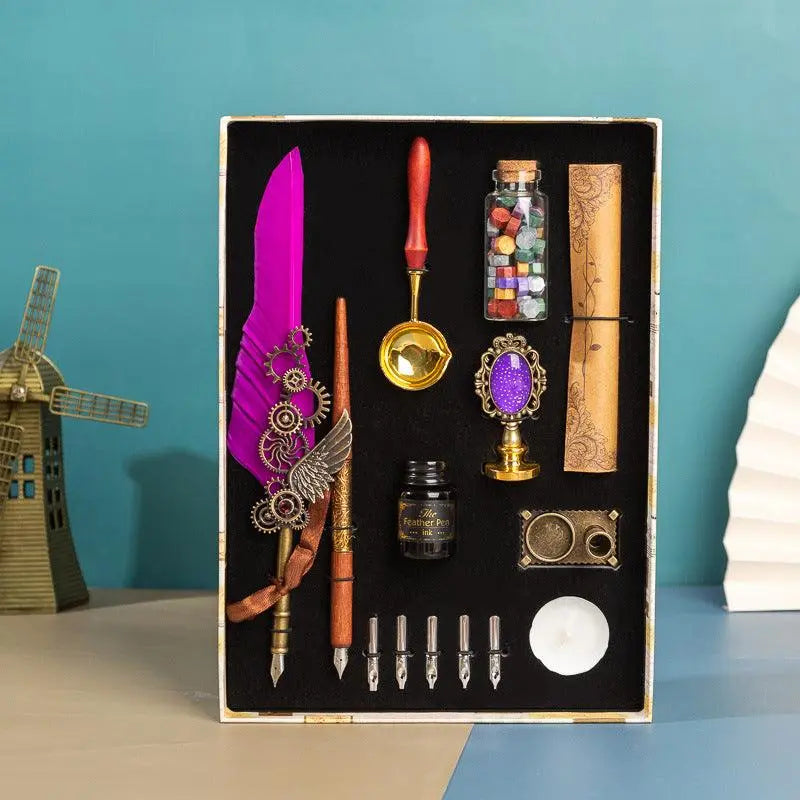 Retro feather pen gift box with brass calligraphy tools, wax seal kit, ink bottle, parchment paper, and replacement nibs in luxury vintage style packaging