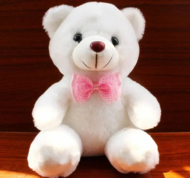 White light up teddy bear plush toy with pink bow and LED glow lights for kids and gifts