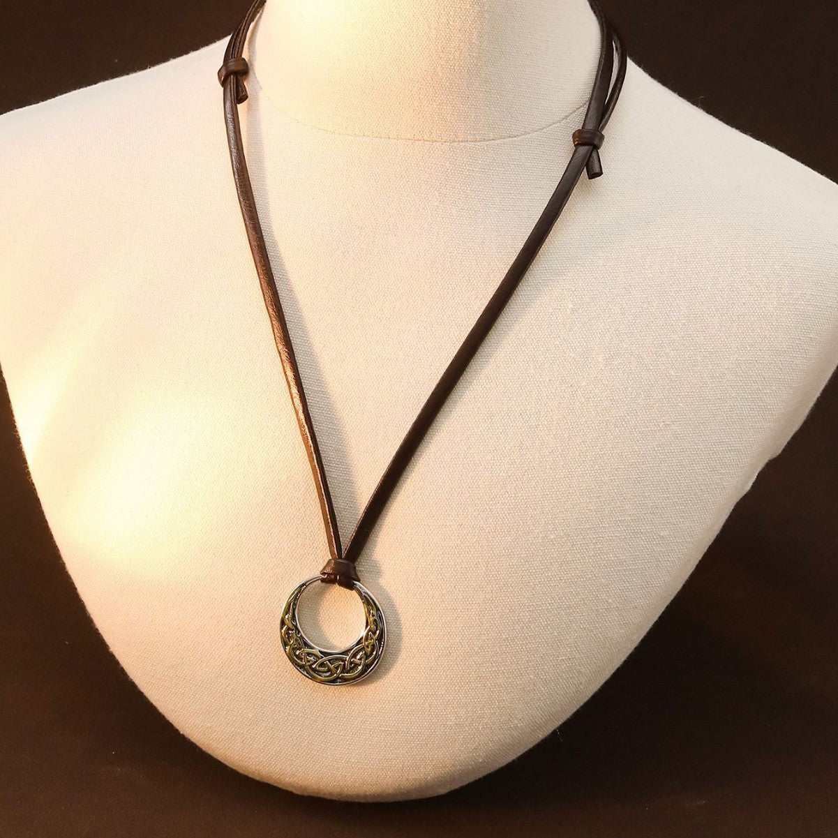 Nordic ethnic sweater chain with round skull pendant on adjustable brown leather cord