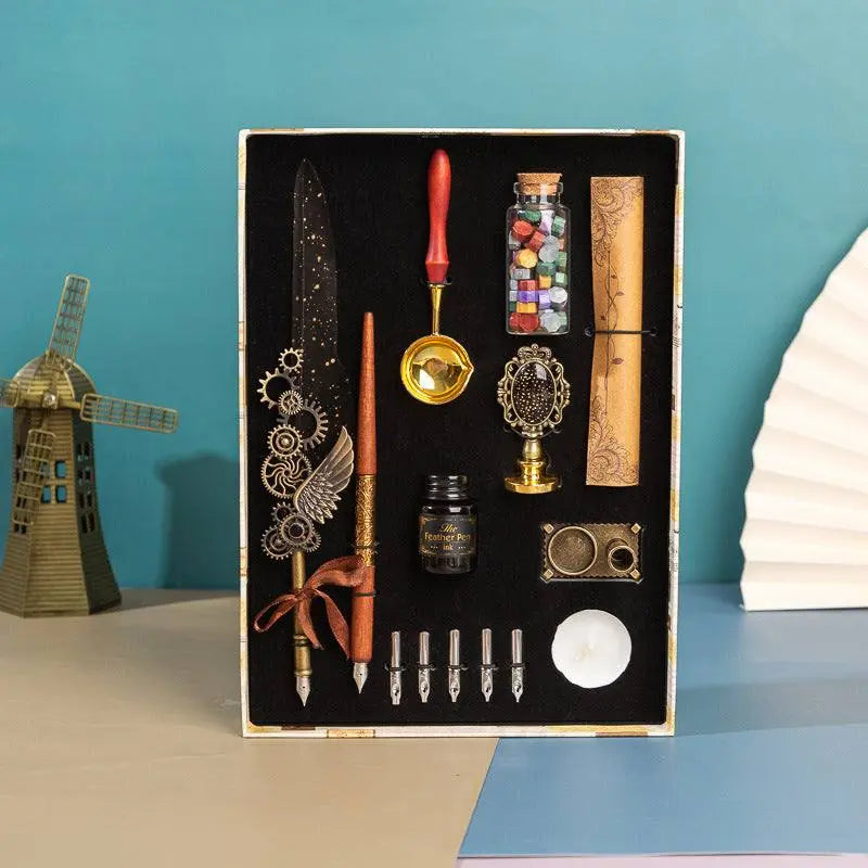 Retro Feather Pen Gift Box with luxury calligraphy set, wax seal, feather and wooden dip pens, ink, candle, and vintage-style accessories in premium packaging