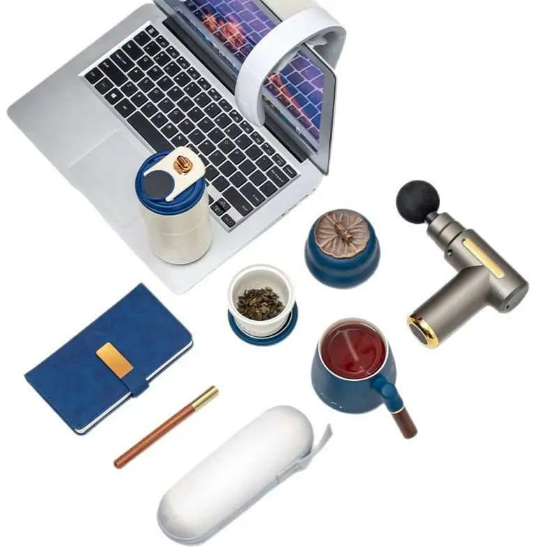 Massage Gun Gift Box with mug, umbrella, powerbank, and business gift set accessories on white background