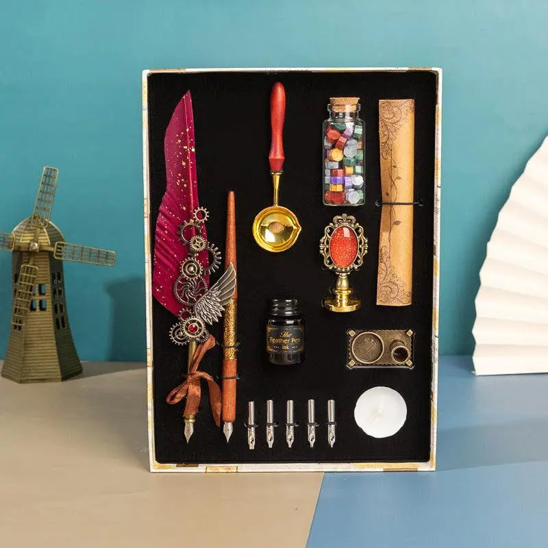 Retro feather pen gift box with wax seal, calligraphy tools, multiple pen tips, and vintage brass accents in a luxury gift set