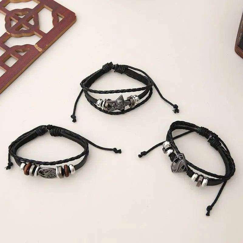 Black leather bracelet set with adjustable cords and metal bead accents, unisex design