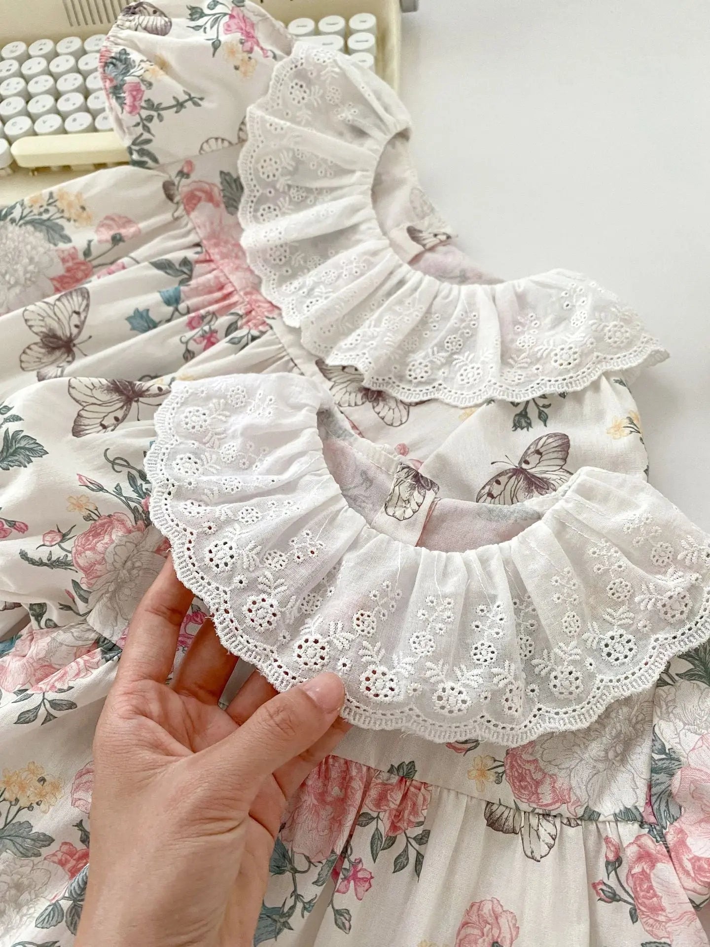 Vintage-style baby girls short sleeve floral and butterfly cotton dress with lace collar in pink and beige