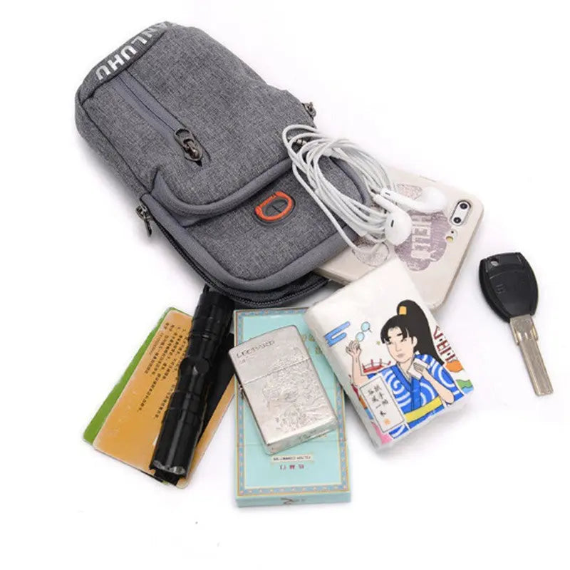 Gray waist bag with phone, keys, and other items on a white background