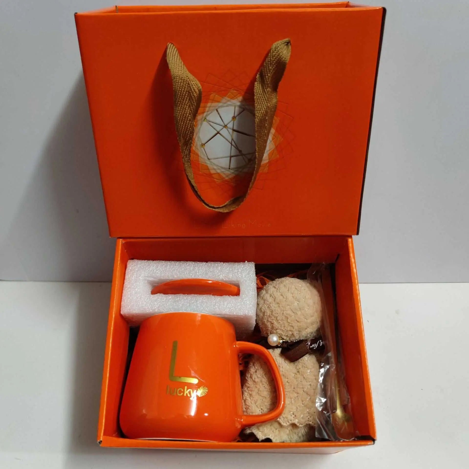 Ceramic cup gift box set with orange letter print mug, spoon, towel, and gift packaging