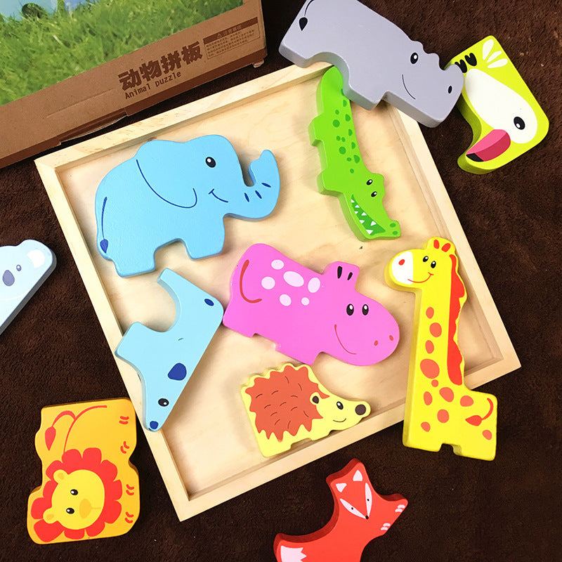 Colorful animal-shaped wooden puzzles in a wooden box on a brown surface.