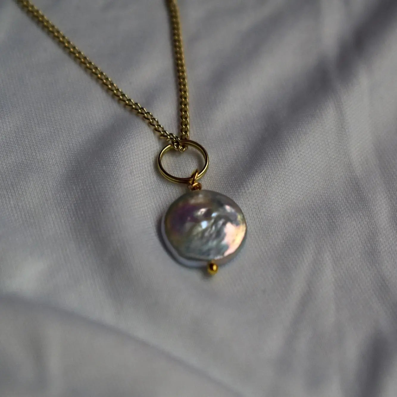 Silver coin freshwater pearl pendant on gold plated necklace chain