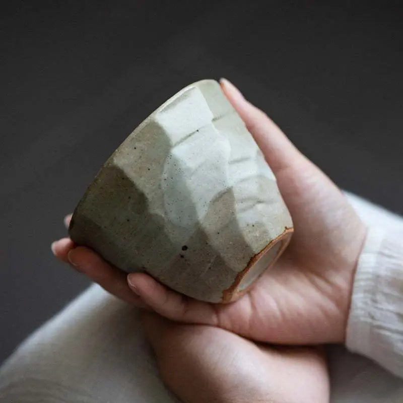 Handcrafted Japanese retro ceramic tea cup from 5-piece Song Jian style set held in hands