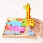 Hand holding a wooden puzzle with animal shapes and a giraffe piece.
