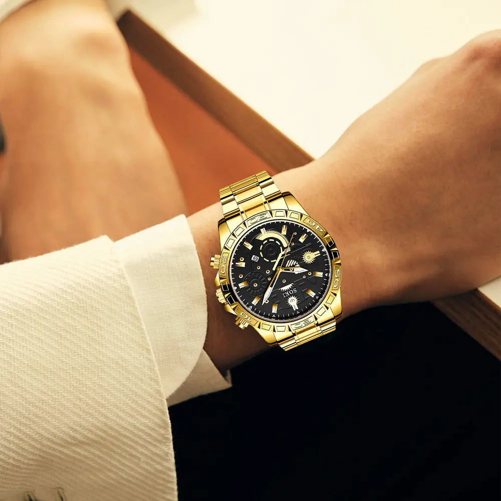 Men's gold coloured watch with black dial on wrist business style