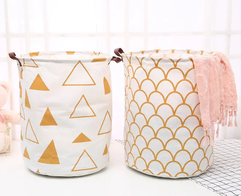 Two fabric storage baskets with geometric patterns on a white background