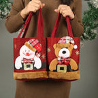 Christmas Gift Tote Bags with Snowman and Bear designs in red cloth with festive decorations