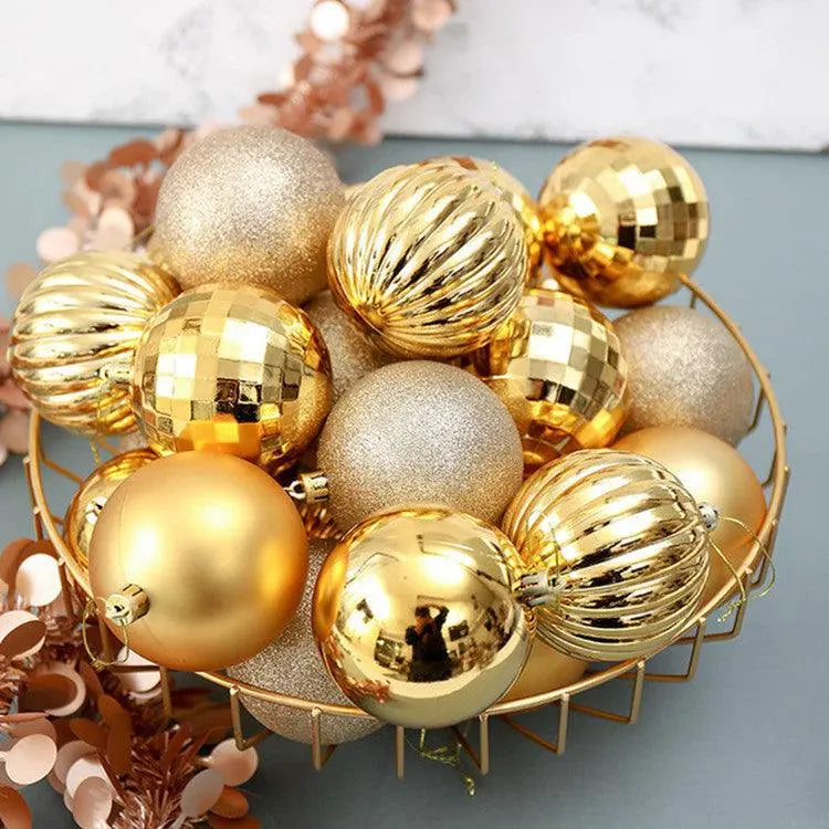 Gold Christmas ball ornaments set with varied textures and finishes in a decorative bowl
