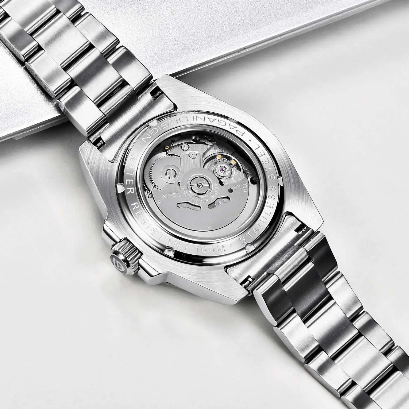 Luxury waterproof mechanical watch with stainless steel band and transparent case back showing movement mechanism