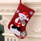 Red Christmas hanging stocking with teddy bear and snowflake decorations