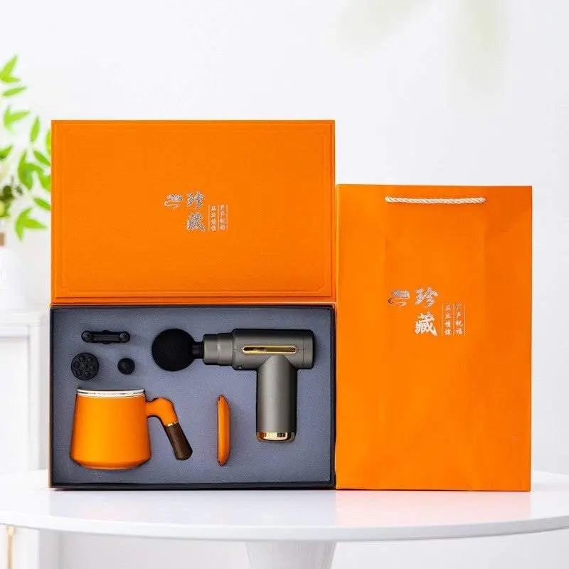 Light luxury massage gun gift box set with mug and accessories in orange packaging
