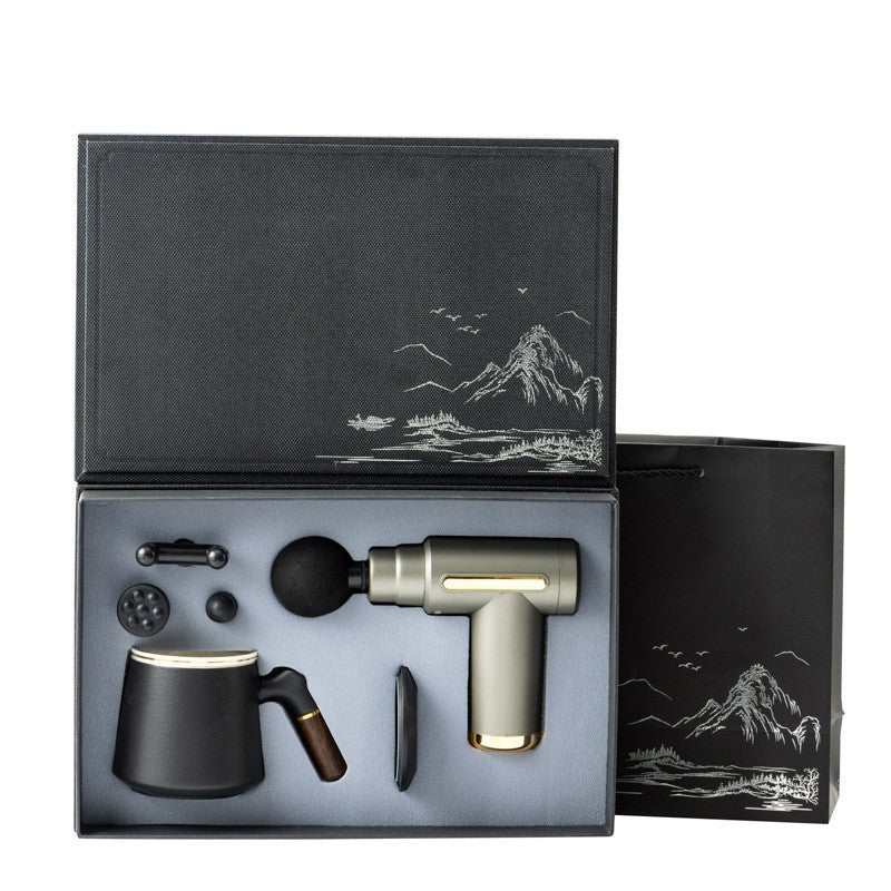 Luxury massage gun gift box set with ceramic mug and interchangeable massage heads in sleek black packaging