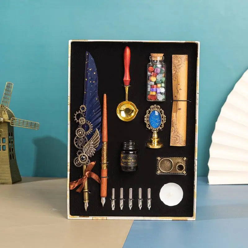 Retro feather pen gift box set with brass calligraphy tools, wax seal accessories, and vintage-style packaging