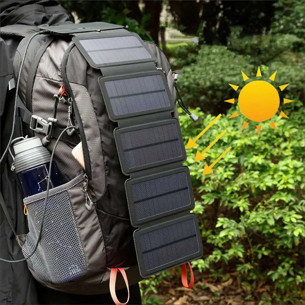 Outdoor folding solar panel charger attached to backpack harnessing sunlight for portable power