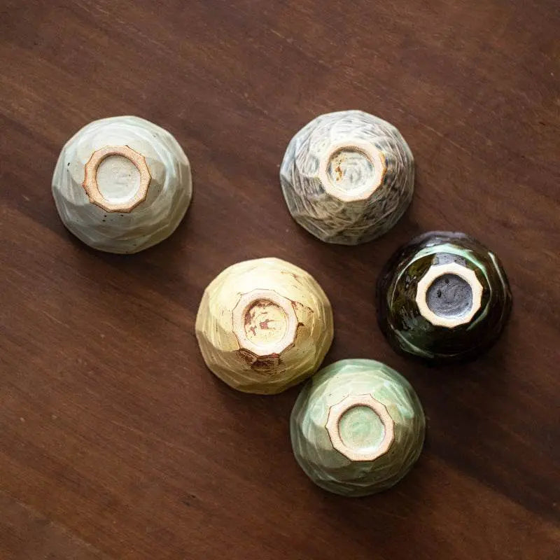 Japanese retro ceramic tea set of five handcrafted Song Jian style bowls on wooden surface