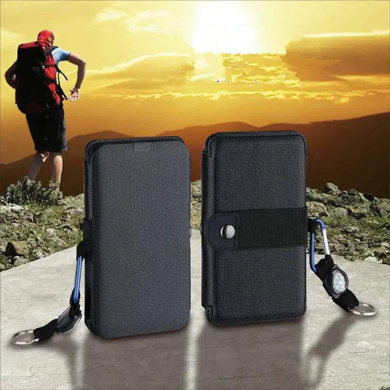 Outdoor folding solar panel charger with compact design and compass keychain in black fabric case