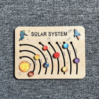 Wooden solar system puzzle on a textured surface