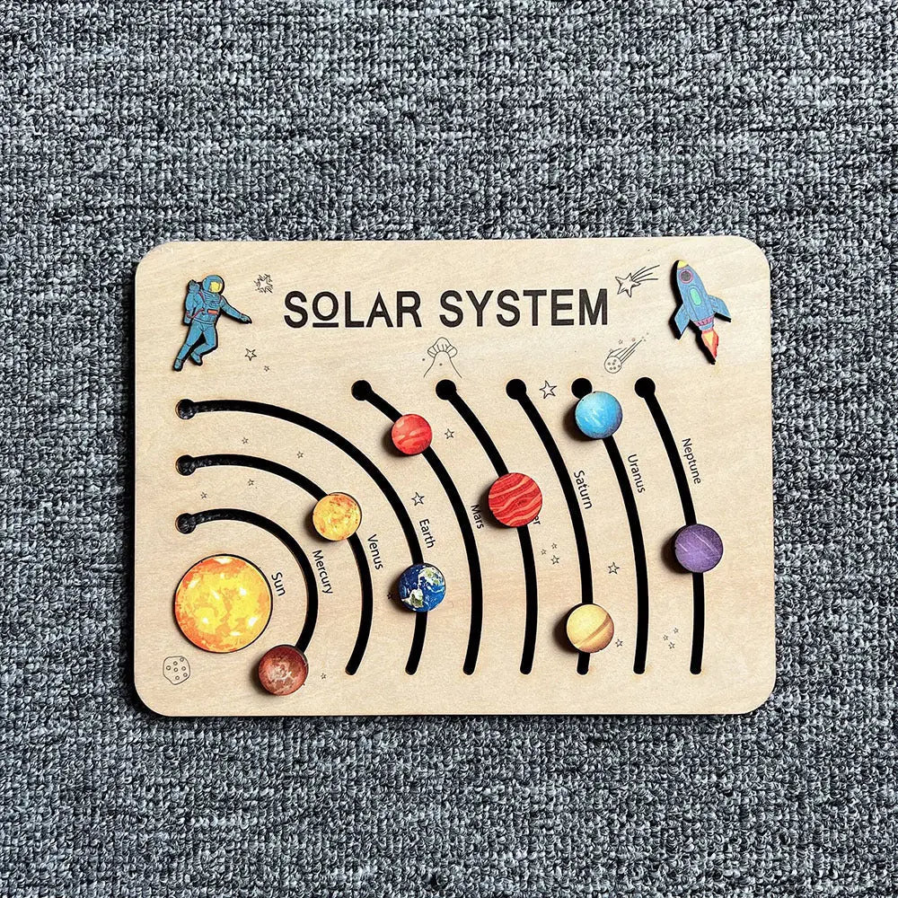 Wooden solar system puzzle on a textured surface
