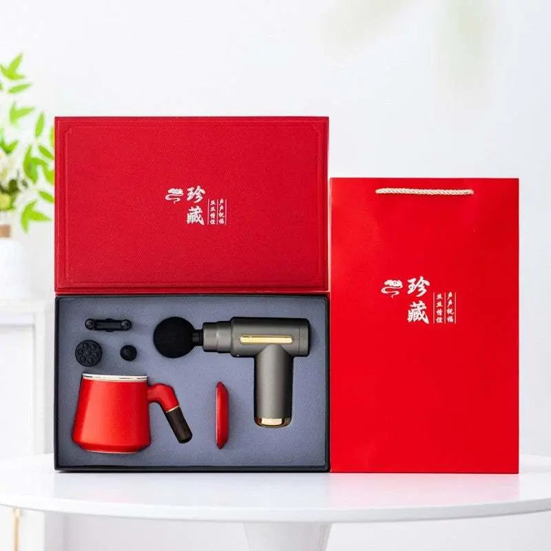 Massage Gun Gift Box with red ceramic mug, umbrella, powerbank, and cordless massager in luxury red packaging.