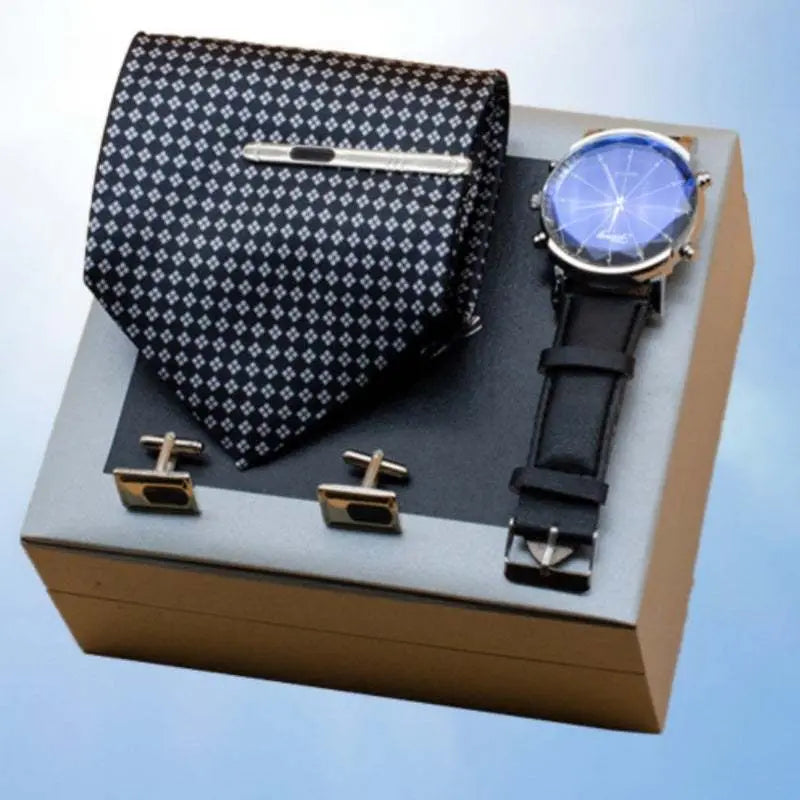 Men’s suit gift box set with black patterned tie, silver tie clip, matching cufflinks, and black leather strap watch in premium box