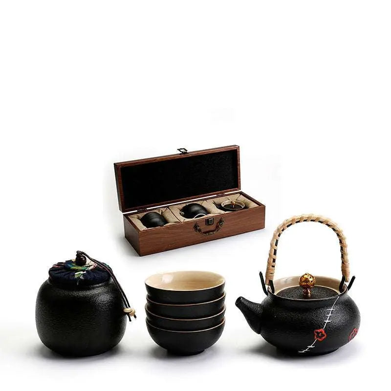 Ceramic Kung Fu Tea Set with black teapot, four matching cups, black tea jar, and elegant wooden gift box