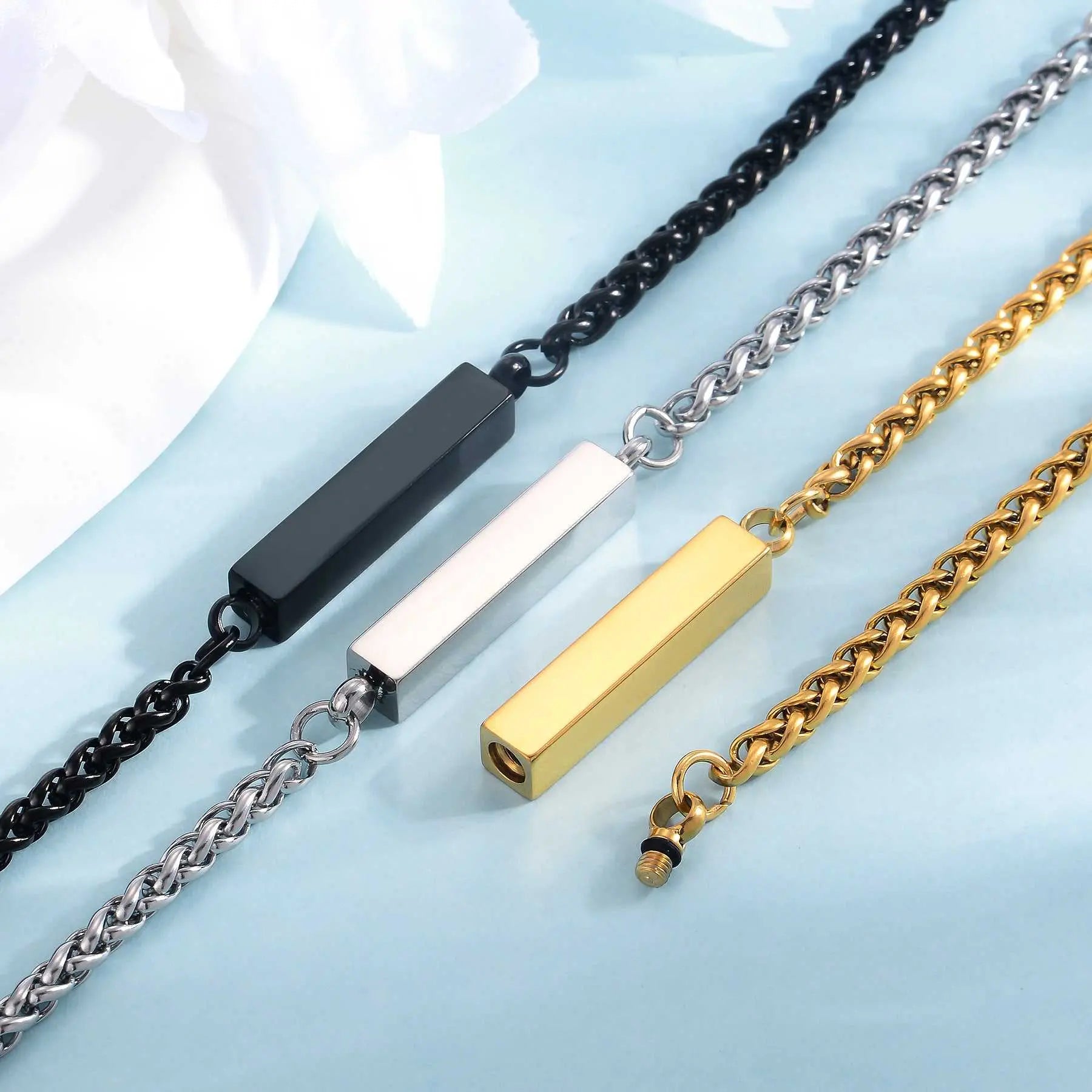 Unisex stainless steel rectangular column bracelets in black, silver, and gold with chain links, minimalist titanium steel jewelry