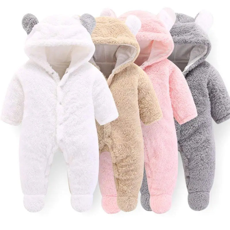 Fluffy baby winter jumpsuits with hood and bear ears in white, beige, pink, and gray colors designed for warmth and comfort.