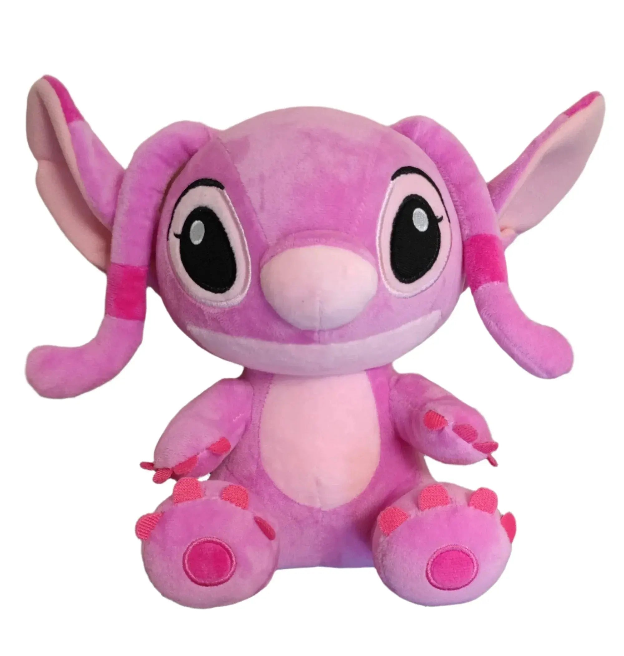 Pink plush toy with large eyes on a white background