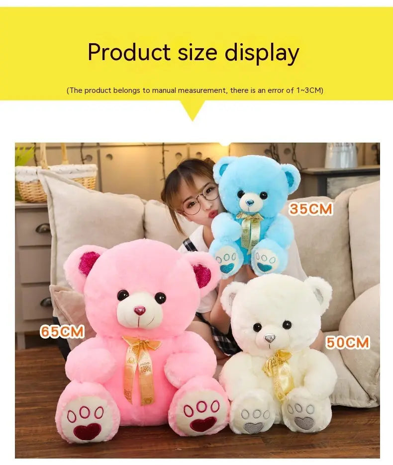 Huggable Heart Teddy Bear Plush in pink, white, and blue, soft and cuddly toy bears with heart-shaped paw detail, perfect size for children.