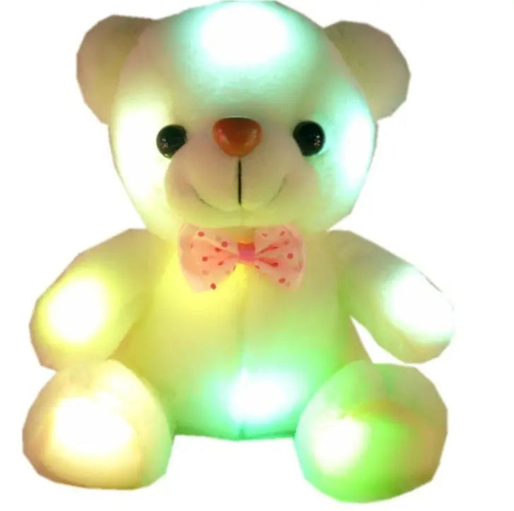 Light Up Teddy Bear plush toy glowing with colorful LED lights and pink bow tie