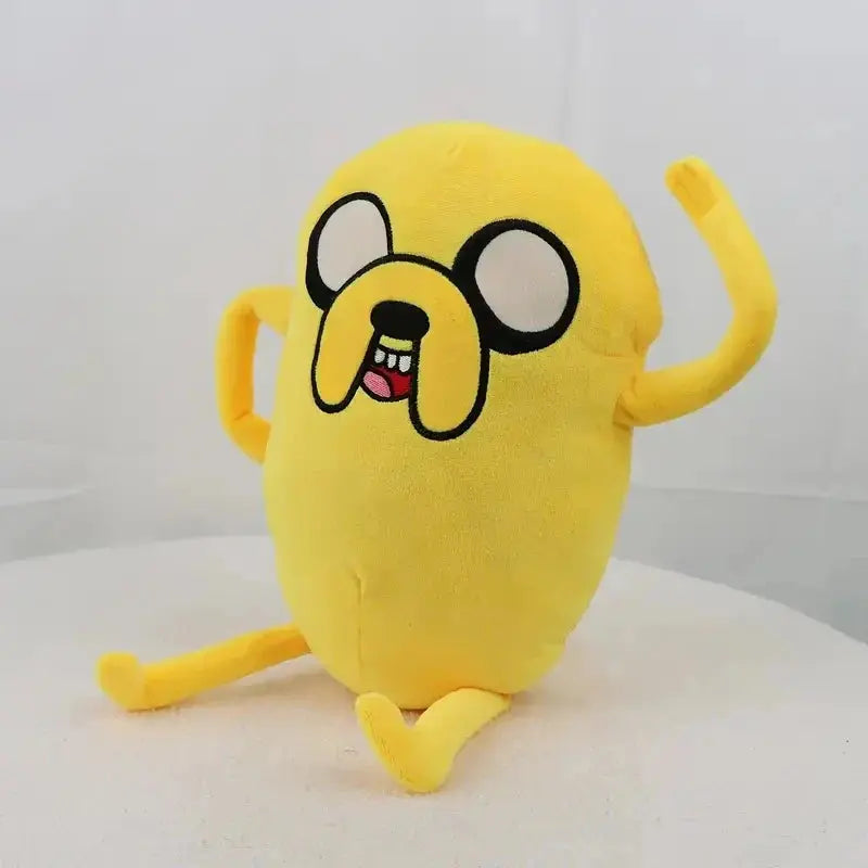 Yellow plush toy with a cartoon face on a white background