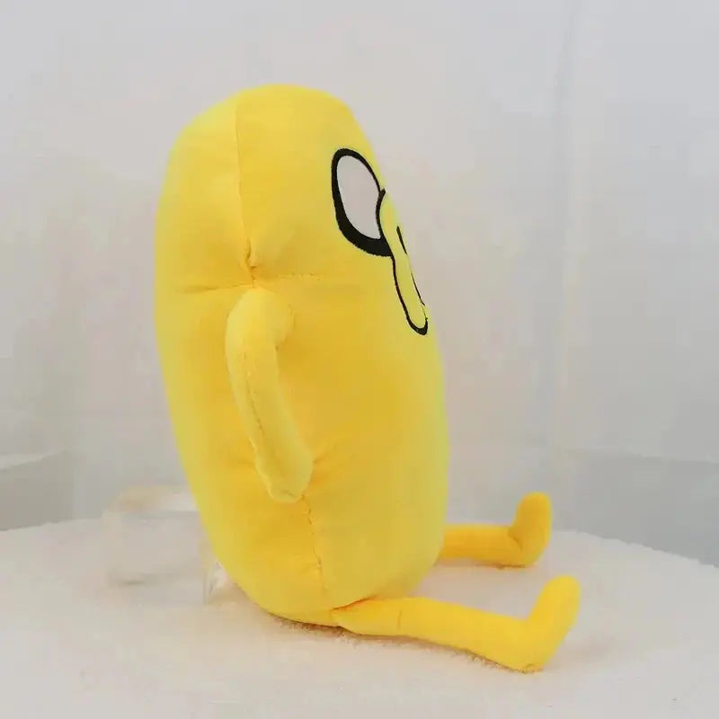 Yellow plush toy with a sad face on a white background