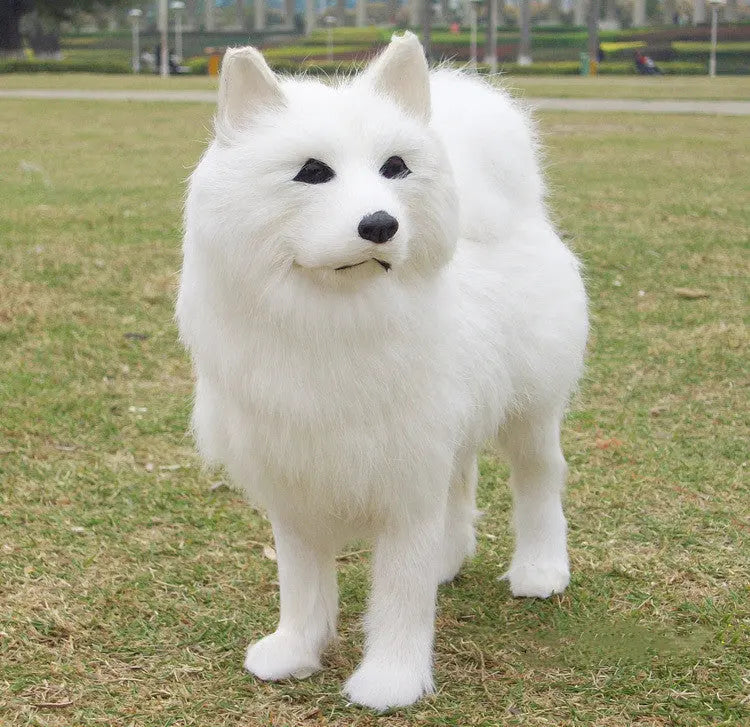 Handmade lifelike white Samoyed plush toy with soft rabbit hair fur standing on grass outdoors